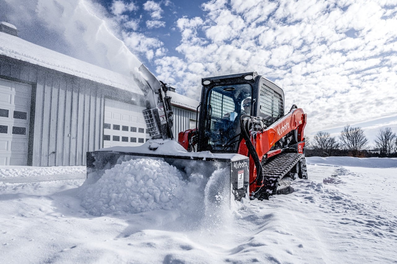 Kubota compact track loader clearing snow